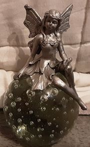 collectable paper weight with fairy on top
