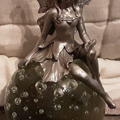 collectable paper weight with fairy on top