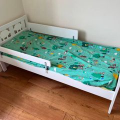 White toddler bed with safety rail