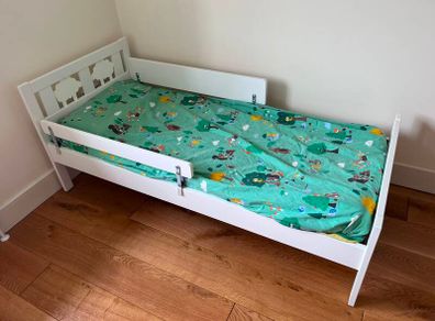White toddler bed with safety rail
