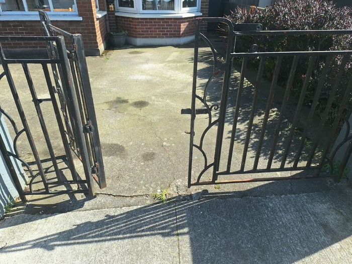 Black wrought iron mdtal double garden gates