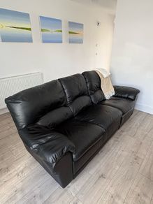 Leather sofa with a seat recliner