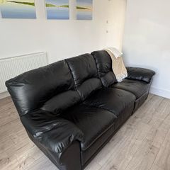 Leather sofa with a seat recliner