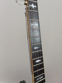 Sliding banjo fifth string capo