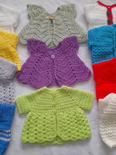Handmade baby cardigans and dresses from newborn