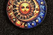Sun / moon,  Pin back badge.