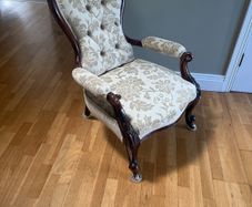 Early Victorian salon/parlor chair in mint condition mahogany on castors.  Restored with original hair.  Beautiful piece of furniture
