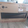 32 inch LG TV with remote and stand in box Image 6