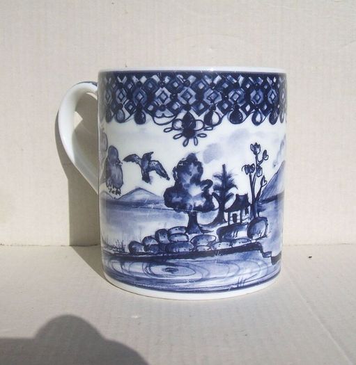 An attractive fine bone china mug with a chinoiserie pattern in an underglaze blue.