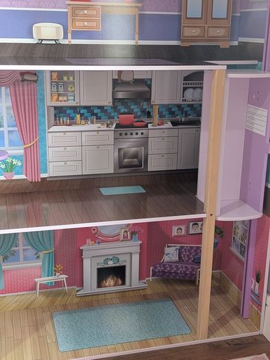Large wooden dolls house with furniture