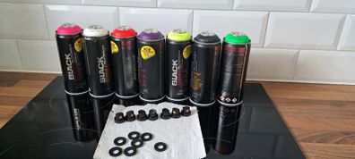 Montana Black fluorescent spray paint cans with assorted caps