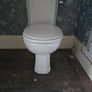 4 traditional style white ceramic toilets available for sale. Image 3