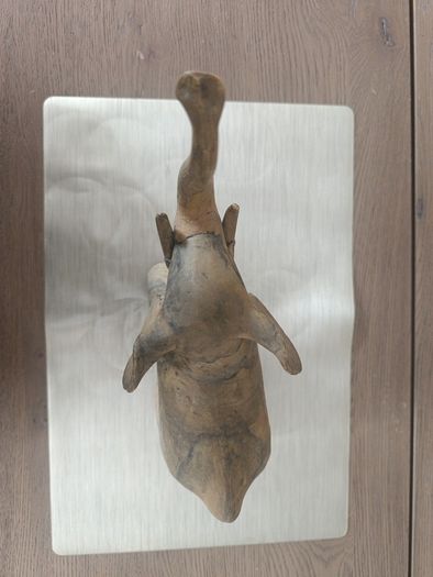 The sculpture is an antique figurine of an elephant