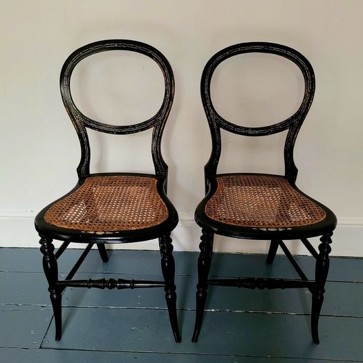 Antique pair of ebonised salon chairs with mother of pearl detail
