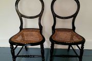 Antique pair of ebonised salon chairs with mother of pearl detail