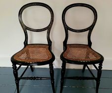 Antique pair of ebonised salon chairs with mother of pearl detail