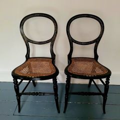 Antique pair of ebonised salon chairs with mother of pearl detail