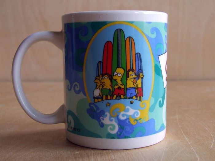 The Simpsons Bart and Maggie surfing mug
