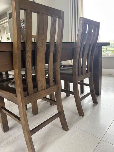 Dining table with glass top and 8 dining chairs