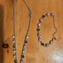 This matching silver-tone crystal necklace and bracelet set features alternating clear and black round stations with textured bezels.  SEE PHOTOS FOR SAME. Image 2