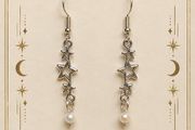 Starry Dreams drop earrings with star charms and pearl detail