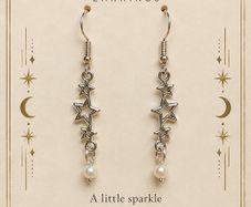 Starry Dreams drop earrings with star charms and pearl detail