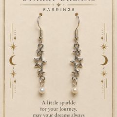 Starry Dreams drop earrings with star charms and pearl detail