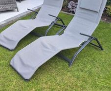 pair of grey reclining garden chairs