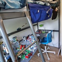 Metal framed loft bed with desk for sale.
