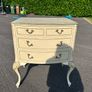 Vintage Olympus cream and gilt Louis style chest of drawers featuring bow-front drawers and cabriole legs. Image 3