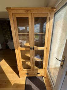 solid oak cabinet with glass doors