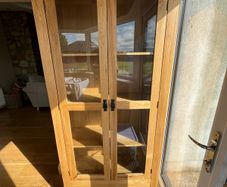 solid oak cabinet with glass doors