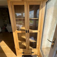 solid oak cabinet with glass doors