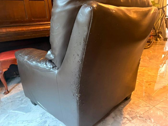 black leather sofa and arm chairs