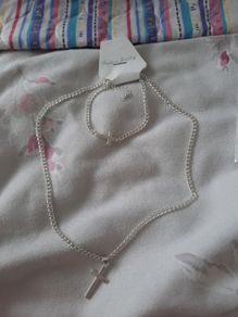 matching silver cross necklace and bracelet