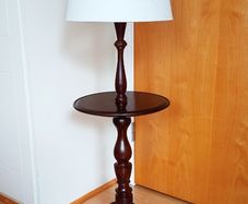 Vintage wooden floor lamp featuring an integrated circular table on classic tripod base  height 109cm