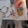 little  collection of broches,a chain and a charm  bracelet Image 3