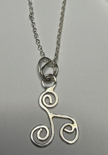 Sterling silver Triskele pendant on 18 or 20 inch chain.