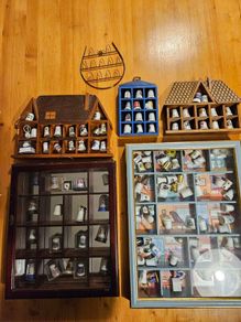 Collection Of Over 120 Ceramic And Metal Timbles In 5 Wall Hanging Cabinets. All In Good Condition.  See Photos For Same.