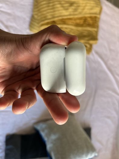 AirPods Pro right hearing piece and case.