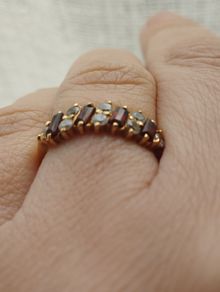 Ring made of 9-karat gold with garnet , weight 2 g, size L.