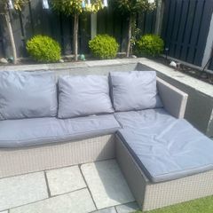 L shaped rattan couch with cushions. In great condition