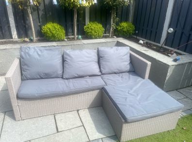 L shaped rattan couch with cushions. In great condition