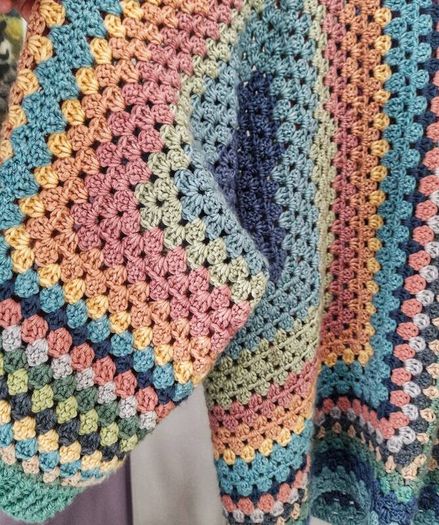 Crocheted colourful hexagon jacket