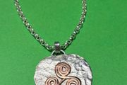 Handmade sterling silver and copper pendant. Choice of 18 or 20 inch necklace