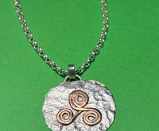 Handmade sterling silver and copper pendant. Choice of 18 or 20 inch necklace