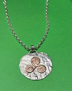 Handmade sterling silver and copper pendant. Choice of 18 or 20 inch necklace
