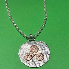 Handmade sterling silver and copper pendant. Choice of 18 or 20 inch necklace