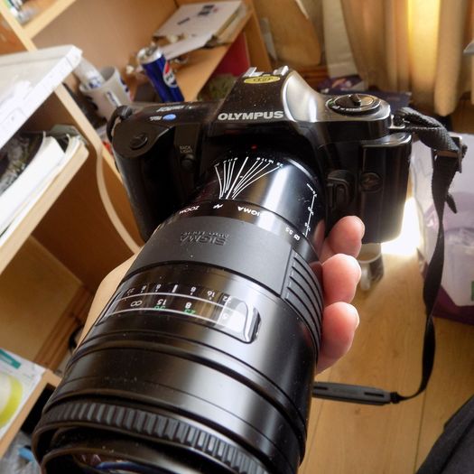 Old heavy Olympus OM101 Camera with lens.