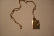 a lovely solid  silver locket and silver chain. in the shape of a book